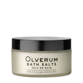 Indulge in Olverum Bath Salts 200g, clear glass jar with black cap perfect for gifting or daily self-care, these bath salts contain essential oils & mineral salts to soothe the senses, ease muscle pain, & replenish skin.