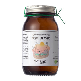 Tribe Skincare Yunohana Natural Hot Spring Bath Powder - 120-Grams amber glass jar with white powder; a unique medicinal bathing powder extracted from hot springs in Japan.
